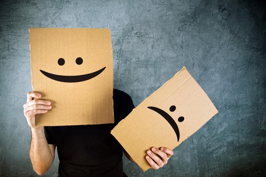 Happy and sad cardboard faces